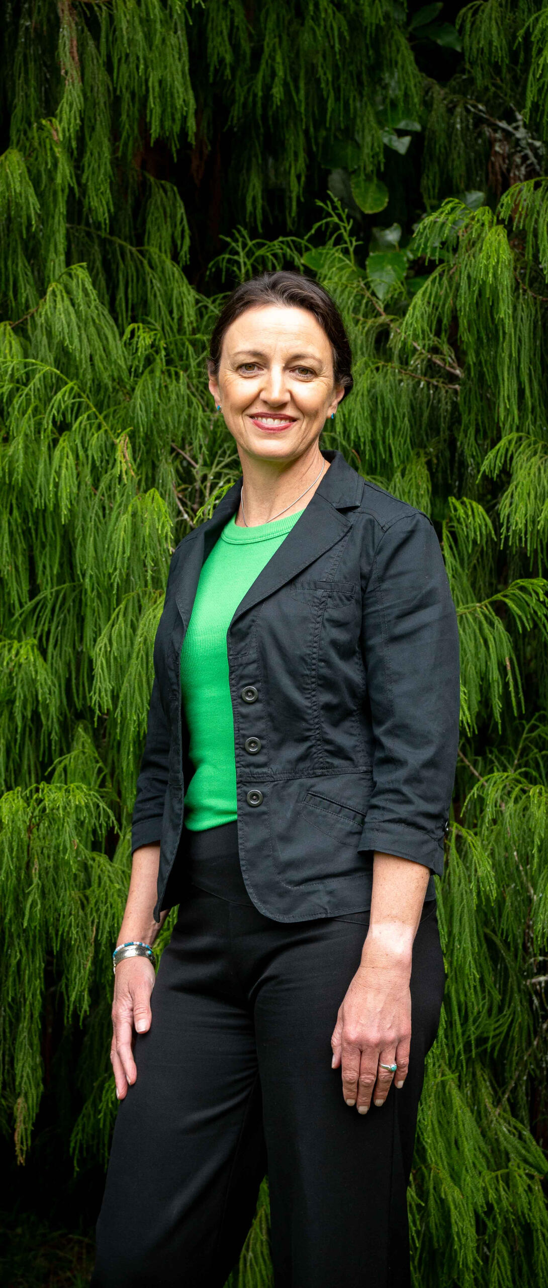 Candidate for New Plymouth mayor and Inglewood ward, Sarah Lucas, in front of a rimu tree